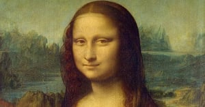 A close up of the face of the Mona Lisa.