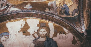 A painting of Jesus in the Divine on a ceiling of a church.