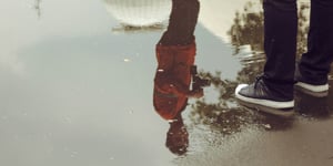 Man's reflection in water. 