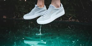 Shoes reflected in water. 