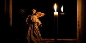 An angel in front of a candle for Advent. 