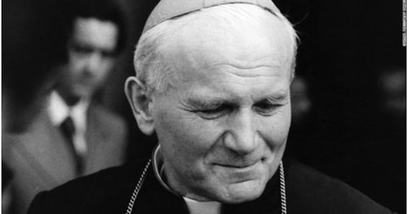 A black and white portrait of Pope John Paull II.