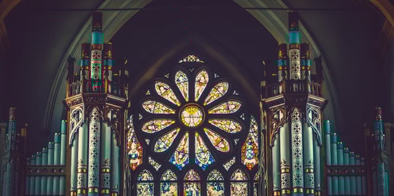 A beautiful rose window with pipe organ accompaniment at St. Peter's Cathedral, Belfast, Northern Ireland