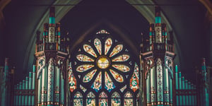 A beautiful rose window with pipe organ accompaniment at St. Peter's Cathedral, Belfast, Northern Ireland