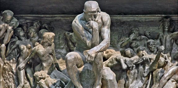 Statue of The Thinker and humans thinking.