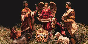 Nativity scene on a dark back ground—the perfect depiction of the begging to the twelve days of Christmas.