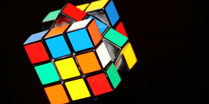 An image of a Rubik's cube turning in the air to represent intellegence.