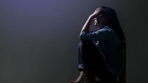 Woman suffering in darkness.