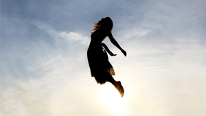 A woman floating in the sky.